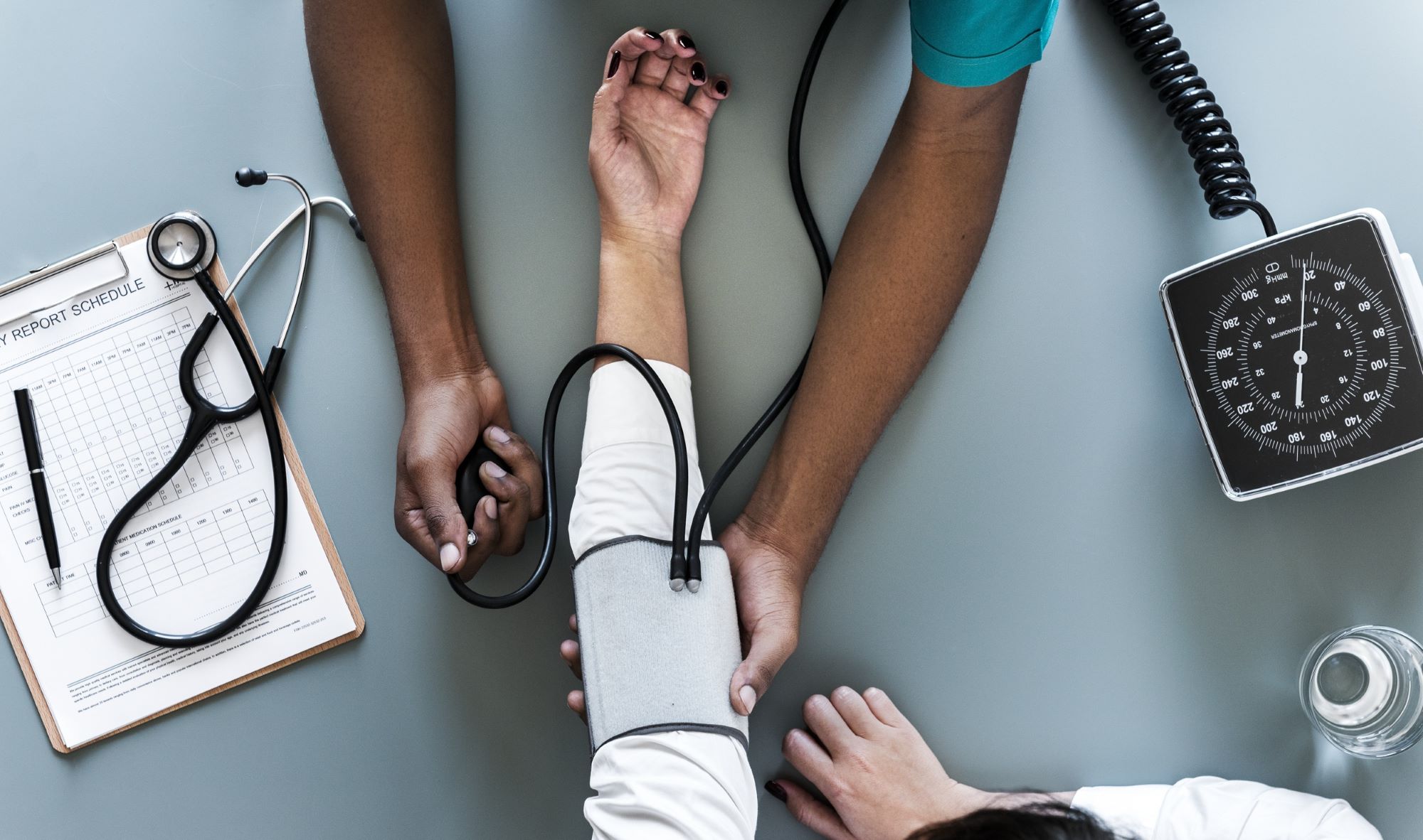 woman having her blood pressure checked